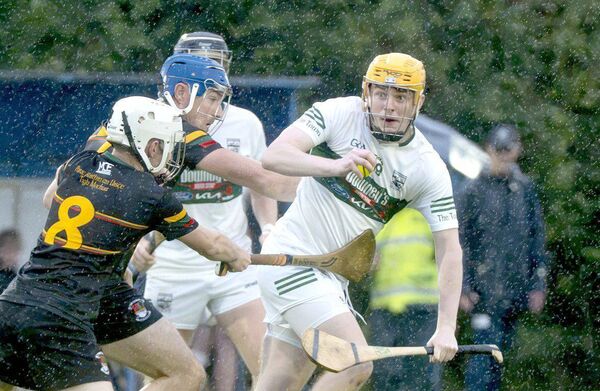 Sean Devitt (Portlaoise) looking to break from Michael Brennan and Tom Fingleton (PRT) on Thursday night 	Photo: Denis Byrne