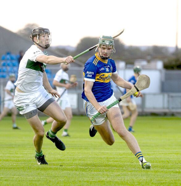 Colm Brennan (Clough/Ballacolla) drives past Portlaoise's Frank Flanagan in their SHC game on Friday 	 Photo: Denis Byrne