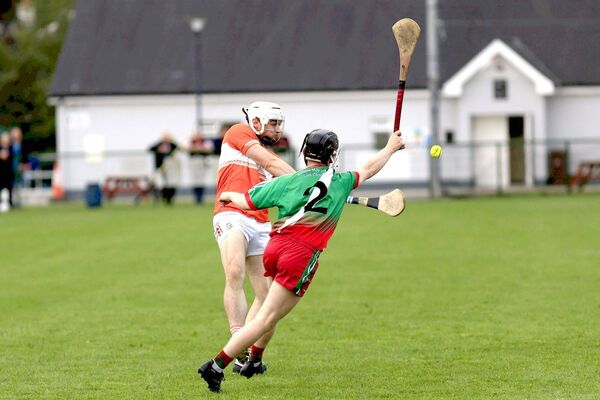 Slieve Bloom's Josh Holmes goes for a score as Borris/Kilcotton's Eoin Daly attempts to block in the IHC quarter-final on Saturday	 Photo: David Maher