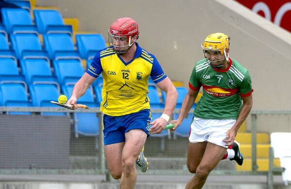 Fionan Mahony (Abbeyleix) breaking away with Thep Fitzpatrick (Rathdowney/Errill) giving chase on Sunday Photo: Denis Byrne Fionan Mahony (Abbeyleix) breaking away with Thep Fitzpatrick (Rathdowney/Errill) giving chase on Sunday Photo: Denis Byrne