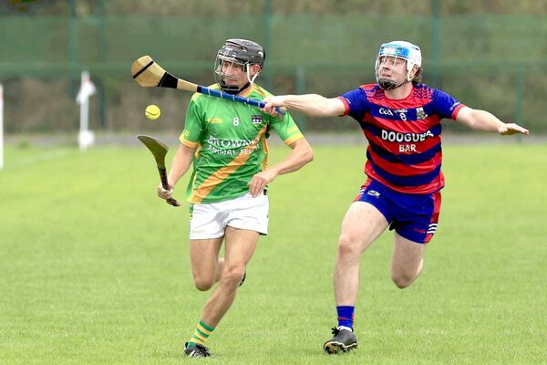 Colt-Shanahoe's Mark Hearns attempts to stop James Whelan's (Clonad) progress in their PIHC quarter-final Photo: David Maher