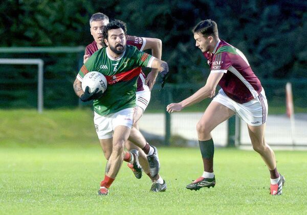 Luke Alysbury (Graiguecullen) on the move as Evan Lyons (Portarlington) moves in to challenge Photo: Denis Byrne Luke Alysbury (Graiguecullen) on the move as Evan Lyons (Portarlington) moves in to challenge Photo: Denis Byrne