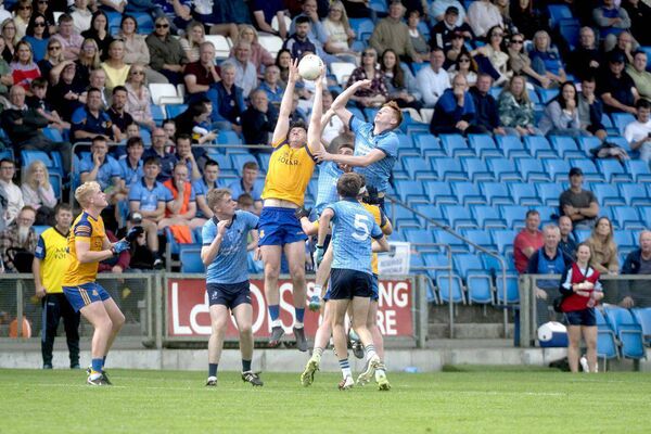 Brian Daly (St Joseph's) gets highest in their aerial battle as Killian Byrne (Ballyroan Abbey) competes Photo: Denis Byrne Brian Daly (St Joseph's) gets highest in their aerial battle as Killian Byrne (Ballyroan Abbey) competes Photo: Denis Byrne