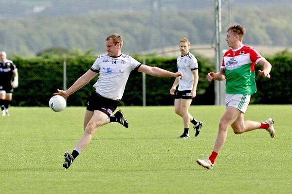 Arles Killeen's Donie Kingston lines up a shot as Clonaslee/St Manman's Adam McDermott moves in to challenge Photo: David Maher Arles Killeen's Donie Kingston lines up a shot as Clonaslee/St Manman's Adam McDermott moves in to challenge Photo: David Maher
