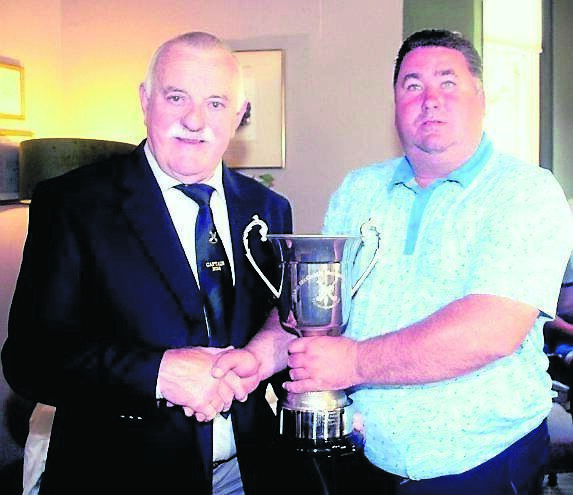 Broughan O’Reilly is presented with the John McGrath Memorial Trophy by Society Captain Seamus Conroy Broughan O’Reilly is presented with the John McGrath Memorial Trophy by Society Captain Seamus Conroy