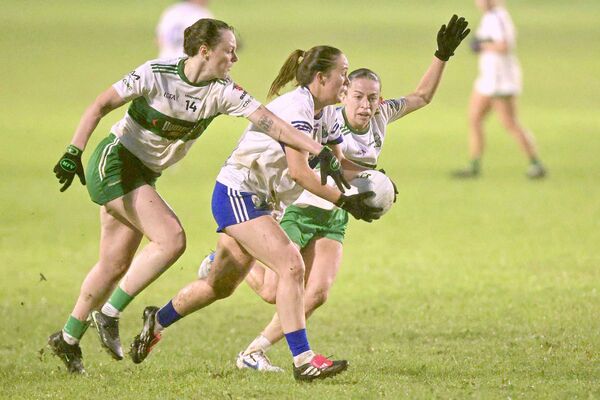 St Conleth's Aoife Cummins is put under pressure by Portlaoise's Grainne Moran and Ciara Crowley in the LGFA SC quarter-final 	 Photo: David Maher