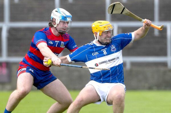 Tadhg Cuddy (Castletown) struggles to shake off the attention of Mark Hearns (Colt Shanahoe) Photo: Denis Byrne Tadhg Cuddy (Castletown) struggles to shake off the attention of Mark Hearns (Colt Shanahoe) Photo: Denis Byrne
