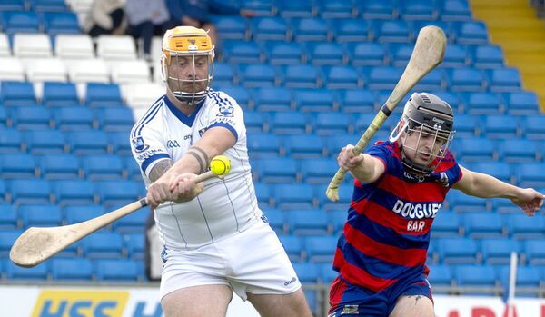 Gearoid Gaughan (Castletown) playing this sliotar clear as Ben McDonald (Colt-Shanahoe) looks to block Photo: Denis Byrne Gearoid Gaughan (Castletown) playing this sliotar clear as Ben McDonald (Colt-Shanahoe) looks to block Photo: Denis Byrne