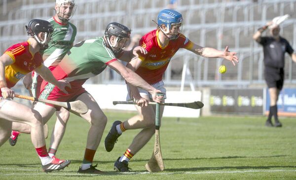 Jack Kennedy (Harps) looking to get his hand on this sliotar as Joe Campion (Borris/Kilcotton) challenges Photo: Denis Byrne Jack Kennedy (Harps) looking to get his hand on this sliotar as Joe Campion (Borris/Kilcotton) challenges Photo: Denis Byrne
