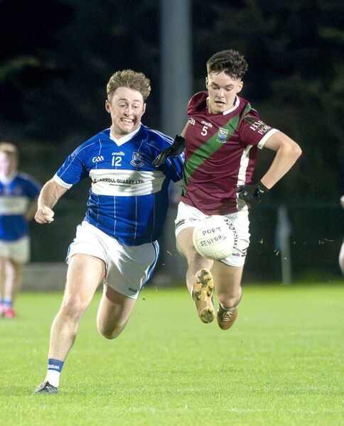 Matthew O'Sullivan (Portarlington) goes on the attack with Tadhg Cuddy (Castletown) giving chase Photo: Denis Byrne Matthew O'Sullivan (Portarlington) goes on the attack with Tadhg Cuddy (Castletown) giving chase Photo: Denis Byrne