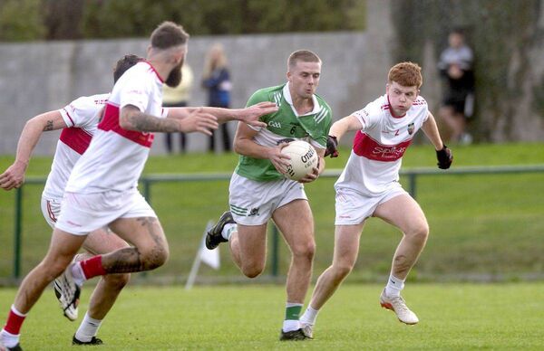 Matthew Bennett (Rosenallis) breaks through a gap in the Emo defence in their SFC 'B' semi-final 	 Photo: Denis Byrne