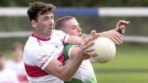 <p>Niall Gorman (Emo) and Matthew Bennett (Rosenallis) get in a tangle as the compete for this ball during the SFC 'B' semi-final Photo: Denis Byrne</p> <p>Niall Gorman (Emo) and Matthew Bennett (Rosenallis) get in a tangle as the compete for this ball during the SFC 'B' semi-final Photo: Denis Byrne</p>