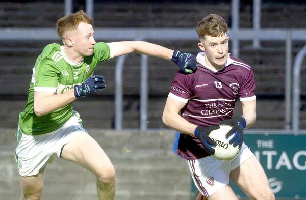 Rory Lalor (Kilcavan) breaking on goal with Conall Rowney (Ballyfin) at his shoulder 	 Photo: Denis Byrne