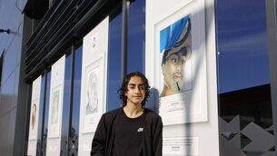 <p>Laois student artist, Abdul Ahad Zulfiqar, with his prize-winning artwork titled 'Study' at the opening of an exhibition of winning works from this year's 72nd Texaco Children's Art Competition at Kildare's busy motorway services hub, Junction 14 Mayfield. Image: Mac Innes Photography</p>