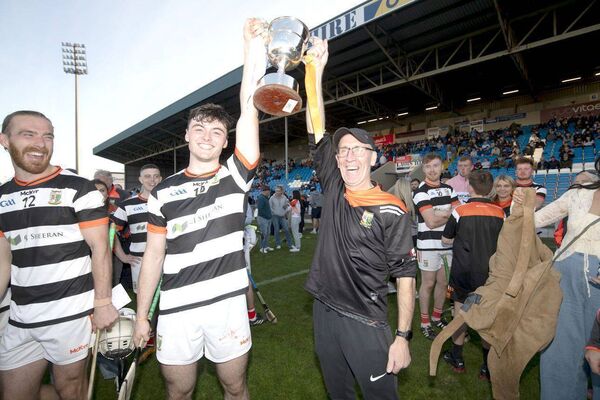 Josh Holmes and Mick Boyhan raise The Hetherington Cup Photo: Denis Byrne Josh Holmes and Mick Boyhan raise The Hetherington Cup Photo: Denis Byrne