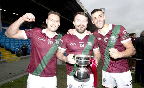 Portarlington captain Paddy O'Sullivan with Jordan Fitzpatrick and Robbie Piggott 	 Photo: Denis Byrne