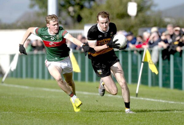 John McNamara (The Heath) with Danny O'Brien (Graiguecullen) moving in to tackle Photo: Denis Byrne John McNamara (The Heath) with Danny O'Brien (Graiguecullen) moving in to tackle Photo: Denis Byrne