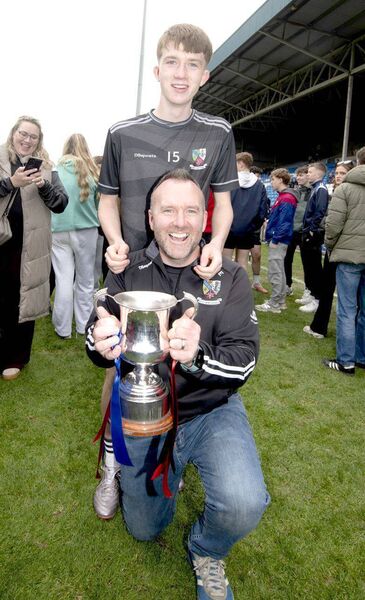Charlie and John McEvoy with U/17 Football Championship Cup 	 Photo: Denis Byrne