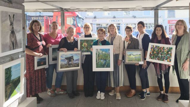 <p>Durrow Art Club members Patricia Prout, Mary O'Dwyer, Valerie Havenden, Patricia Troy, tutor Marie Moylan, Ger Molloy, Kathleen Collier, Ann-Marie Deegan pictured with senior library assistant Vera Quinn and gallery manager Martina O'Connor while hanging the exhibition Photos: Stan Henderson</p>