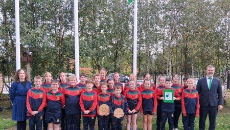 Gaelscoil Phortlaoise proudly raises Travel Green Flag 