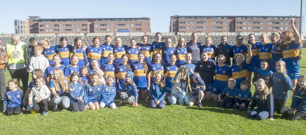 The Clough/Ballacolla players, mentors and supporters celebrate their Laois Junior Camogie Championship final win over St Brigid's at Laois Hire O'Moore Park on Saturday Photo Denis Byrne The Clough/Ballacolla players, mentors and supporters celebrate their Laois Junior Camogie Championship final win over St Brigid's at Laois Hire O'Moore Park on Saturday Photo Denis Byrne