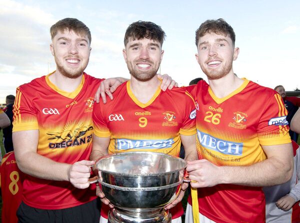 Conor, Padraic and Rory Dunne with the Bob O'Keeffe Cup 
