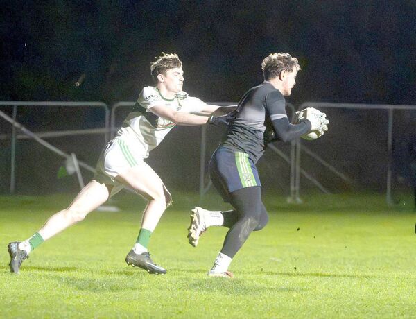 Anthony Skelly, Stradbally Parish Gaels goalkeeper, bringing this ball out with Rory Tully (Portlaoise) attempting to halt his progress in their U/20 Football Championship game on Friday Photo: Denis Byrne Anthony Skelly, Stradbally Parish Gaels goalkeeper, bringing this ball out with Rory Tully (Portlaoise) attempting to halt his progress in their U/20 Football Championship game on Friday Photo: Denis Byrne