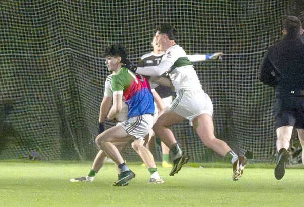 Oran Darcy (SPG) moving to set himself for a play as Sean Powers (Portlaoise) challenges Photo: Denis Byrne Oran Darcy (SPG) moving to set himself for a play as Sean Powers (Portlaoise) challenges Photo: Denis Byrne